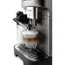 Front view of DeLonghi ECAM290.81 Magnifica Evo Coffee Machine preparing layered cappuccino with milk froth and espresso.