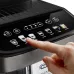 Close-up of DeLonghi ECAM290.81 Magnifica Evo Coffee Machine control panel with finger pressing illuminated drink icon.