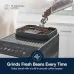 Top view of DeLonghi ECAM290.81 Magnifica Evo Coffee Machine as coffee beans are poured into grinder with 13 settings.