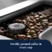 Close-up of DeLonghi ECAM650-85 Primadonna Elite Coffee Machine grinder knob surrounded by roasted coffee beans.