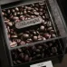 Top view of DeLonghi KG89 Coffee Grinder bean container filled with roasted beans and embossed brand logo visible.