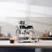 DeLonghi La Specialista Prestigio espresso machine steaming milk with a stainless steel pitcher