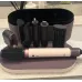 Top case view of Dyson Airwrap Co-anda2x Multi-Styler and Dryer showing attachments organized inside storage box