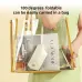 Front view of foldable eye massager packed inside transparent travel bag showing compact portable storage design