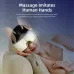 Front view of person wearing eye massager while resting, showing hands simulating gentle massage effect