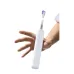 Side view of VK13 toothbrush held in hand highlighting slim body and ergonomic grip design