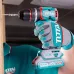 Workshop view of TOTAL TIDLI205581 Drill Machine driving a screw into wood with 20V MAX battery and teal casing.
