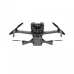 A close-up, grayscale, head-on view of the DJI Mini 5 Pro Fly More Combo drone, highlighting its front sensors and camera.