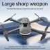 Top-down view of the black U6 Toy Drone with its arms extended, hovering over a calm water surface.