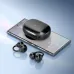 Open-ear BWOO BO-BW39 earbuds and charging case resting on a smartphone playing music.