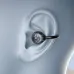 Close-up on the black BWOO BO-BW39 open-ear earbud with an exposed chip in an animated ear.