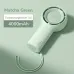 Angled view of the Jisulife Life5 Plus FA43 Mini Handheld Fan in matcha green displaying wrist strap and folded handle.