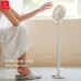 Usage view of Xundd XDOT-063 Multi Functional Clip Fan placed on floor with adjustable height
