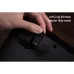 Underside view of 8BitDo Arcade Stick with hidden 2.4G wireless adapter compartment being accessed.