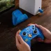 Person playing with blue 8BitDo Ultimate 40th Anniversary Rare Edition.