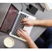 Lifestyle view of the Toshiba Canvio Ready 1TB USB 3.2 External HDD connected beside a laptop on a desk workspace