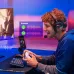 A gamer wearing the ASUS ROG Delta II headset, with Bluetooth connection icon and audio waveforms displayed.