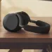 Desk view of Jabra Evolve3 85 MS LINK390C Wireless Headphone showing folded design placed on wooden surface