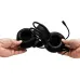 Hands holding and twisting the ultra-flexible headband frame of the T-WOLF H130 gaming headset to demonstrate its durability and flexibility.
