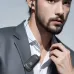 Lifestyle view of XO BE51 Clip On Headphone clipped to clothing while in use.