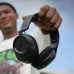 Corsair HS35 v3 Wireless Headphone being carried outdoors, highlighting its lightweight portable design.