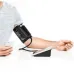 Beurer BM-58 Blood Pressure Monitor shown in use with an upper arm cuff, highlighting automatic blood pressure measurement.