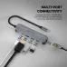 Close-up view of Fantech HC051 NeraLINK 5-in-1 Type-C Hub connected to laptop showing multi-port connectivity with cables attached