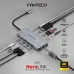 Close-up angled view of Fantech HC101 NeraLINK 10-in-1 Type-C Hub connected to devices showing multiple ports in active use