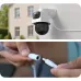 Wall-mounted Meari S7 Dual Plus WiFi camera with hands connecting power adapter cable below.