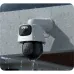 Close-up angle of Meari S7 Dual Plus WiFi camera mounted on a white outdoor wall.