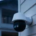 Rain-soaked Meari S7 Plus PTZ WiFi Camera mounted on building wall highlighting weather-resistant design.