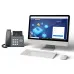 Office desk view of Grandstream GRP2612 IP Phone beside monitor showing GDMS login page for device management.