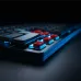 Close-up of Logitech G515 RAPID TKL Keyboard with removed keycaps revealing red mechanical switches and blue backlighting.