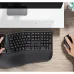 Desk view of the Meetion DirectorC Wireless Keyboard Mouse Combo showing full keyboard and mouse in an ergonomic workspace setup.