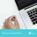 Close-up view of TP-Link Archer TX1U Nano AX300 USB Wi-Fi 6 Adapter plugged into laptop USB port highlighting compact low profile use