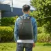 Outdoor view of Asus Nereus 16 inch Laptop Backpack carried by person in denim jacket with red diagonal accent line.
