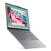 Tilted front view of the Lenovo Yoga Slim 7 14IMH9 Laptop with glowing jellyfish wallpaper and visible left-side ports.