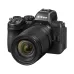 Nikon Z camera with attached NIKKOR Z 24-105mm f/4-7.1 Lens showing textured grip and detailed markings.
