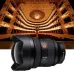 Front view of the Sony FE 12-24mm f/2.8 GM Lens placed in a theater, highlighting its ultra-wide-angle capability.
