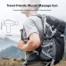 Travel view of Merach MR-M010B2 9D Massage Gun clipped to backpack side pocket in outdoor hiking setting.