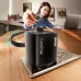 Lifestyle desk view of BWOO BO-CDA232 65W GaN Charger Adapter (UK) powering devices while standing upright on a wooden table