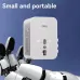 Close-up of Deli ET767 Travel Adapter held by robotic hand against blue background emphasizing portability.