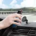 Hand placing smartphone onto UGREEN LP292 magnetic holder on car dashboard, showing easy one-hand use and stable grip.