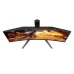 AOC C27G4H2 curved gaming monitor displaying vibrant desert city battle scene with magical effects.