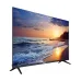Dahua DHI-LM43-F400 display showcasing a vibrant sunset over the ocean, with dramatic waves and a silhouette of trees.