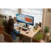 Lifestyle desk view of HP P34hc G4 Curved Monitor displaying calendar and presentation windows in home office.