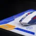 Angled view of colorful Inphic PD60 Gaming Mouse Pad with sleek multi-color mouse labeled PM-100G+ INPHIC MODULE.