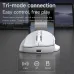 Front view of AJAZZ AJ039 V2 Wireless Mouse beside laptop showing tri-mode connectivity for PC, tablet, and phone.