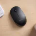 Workspace view of Asus MW103 Wireless Mouse placed on desk beside keyboard and accessories with sleek design.