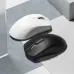 Top-down view of white and black Furycube G1 Mouse side by side, highlighting color contrast and sleek design.